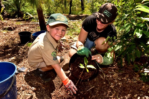 Owen planting a tree.JPG