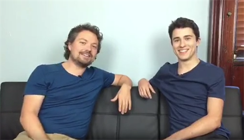 Daniel Johnsen and Ben Kennedy sitting on a black couch