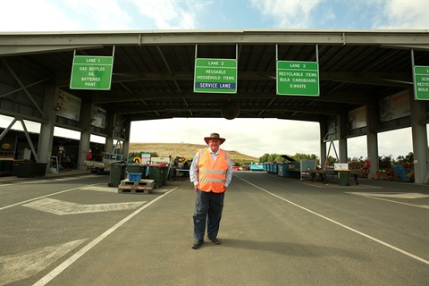 Councillor Fisher at the Lakes Creek Road Landfill recycling area.JPG