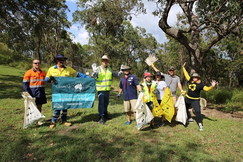 Councillor Latcham and Council Waste Officers are posing and smiling with Mount Archer Scouts