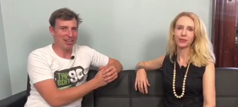 Wes Alan and Elize Hattin sitting on a black couch