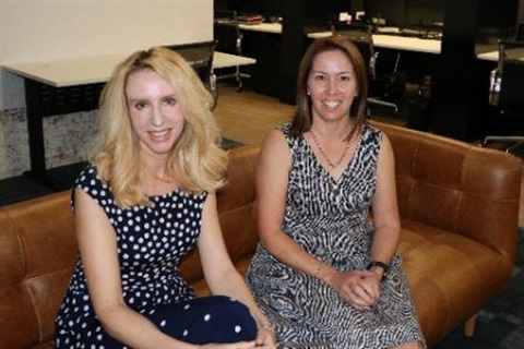 Photo of Elize Hattin and Marni McGrath sitting on the couch at SmartHub Rockhampton
