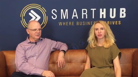 Drew Stevenson and Elize Hattin on a tan couch with SmartHub logo behind