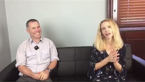 Tony Davys and Elize Hattin sitting on a black couch